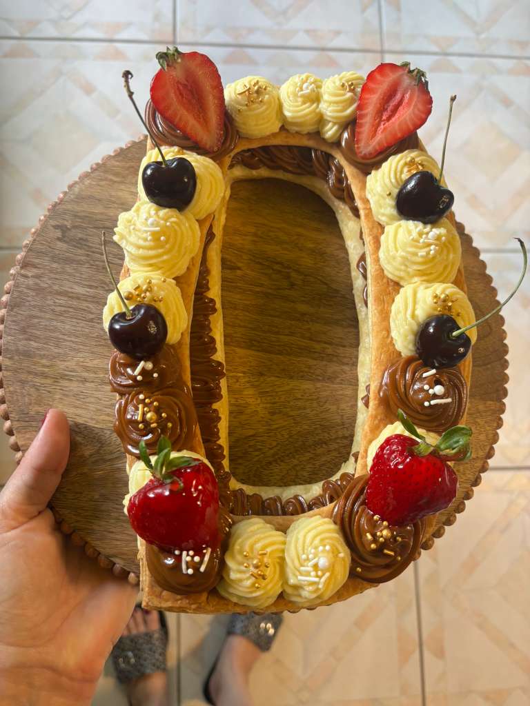 Letter D shaped milhojas dessert