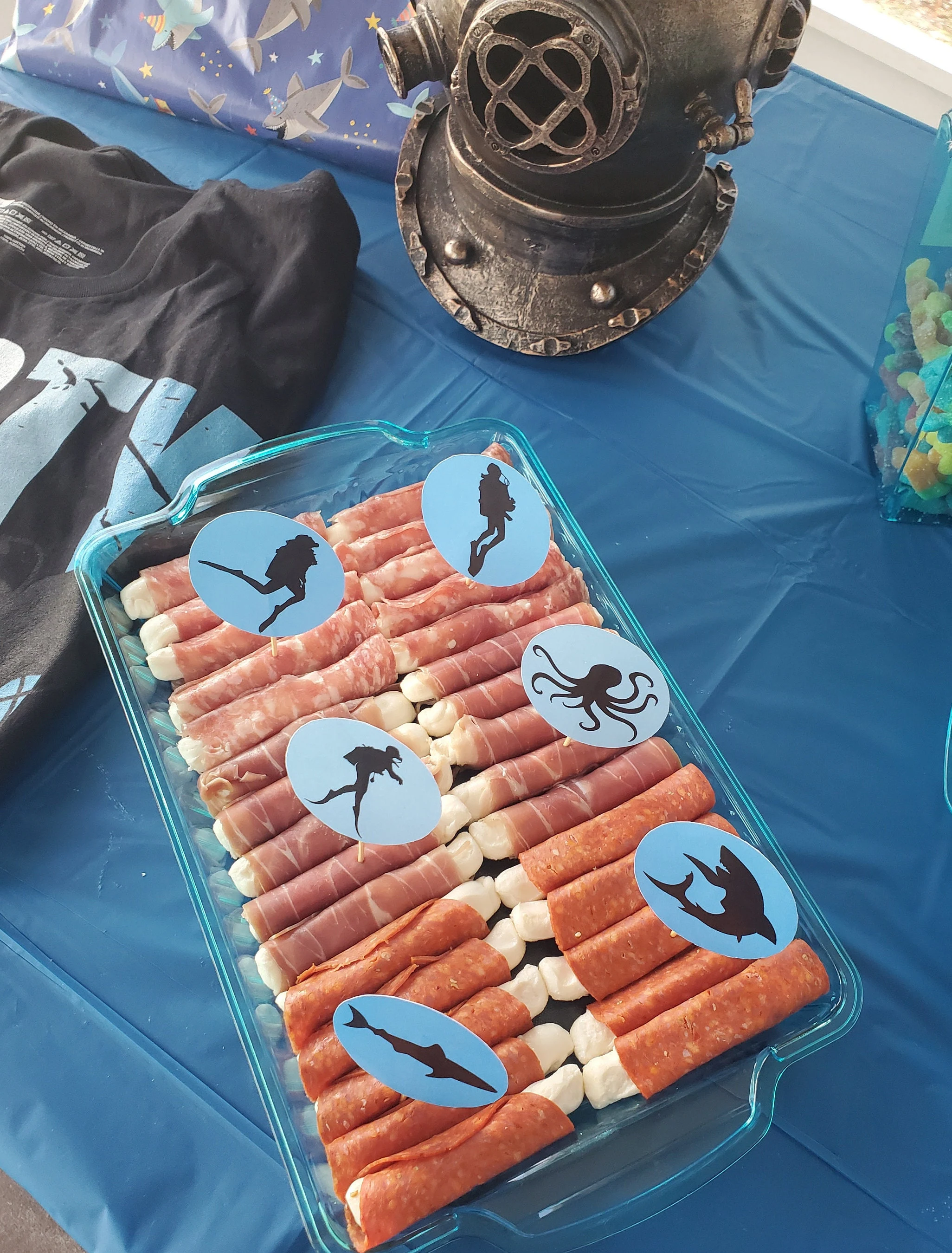 Blue ocean silhouette party toppers displayed on a food tray